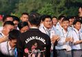 Melongo, Begini Reaksi Menpora ketika Melihat Presiden Jokowi Kenakan Jaket Bermotif Asian Games