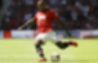 Manchester United's Patrice Evra controls the ball during their English FA Community Shield soccer match against Wigan Athletic at Wembley Stadium in London, Sunday, Aug. 11, 2013. (AP Photo/Kirsty Wigglesworth)