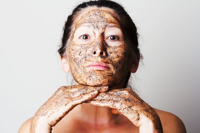 - mature woman making cosmetic mask from coffee, sour cream.