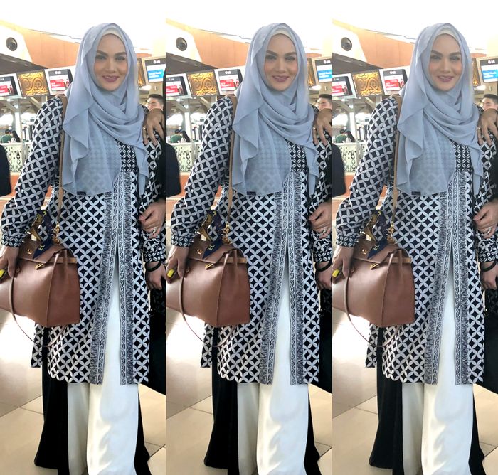 Krisdayanti terlihat menenteng sebuah tas