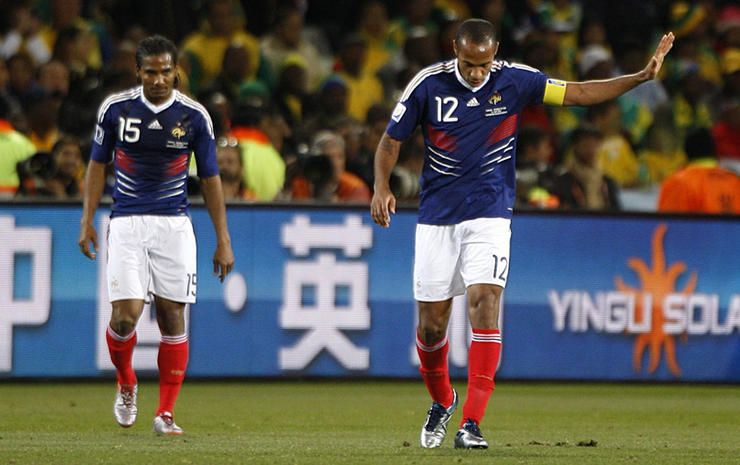 France's Thierry Henry (right) apologises to his teammates after a missed chance