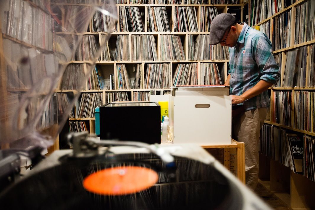 Oliver Wang, a vinyl record collector, writer and music journalist from Los Angeles, CA photographed with his vinyl collection at his home for Dust & Grooves. © Copyright - Eilon Paz - www.dustandgrooves.com