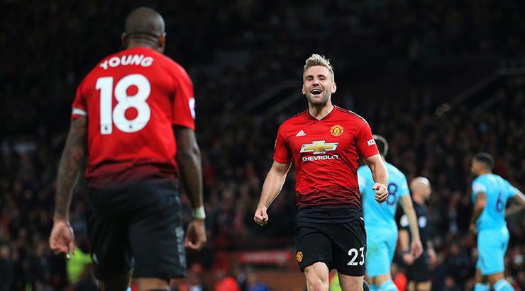 Manchester United's Luke Shaw celebrates with Ashley Young after the third goal during the Premier L