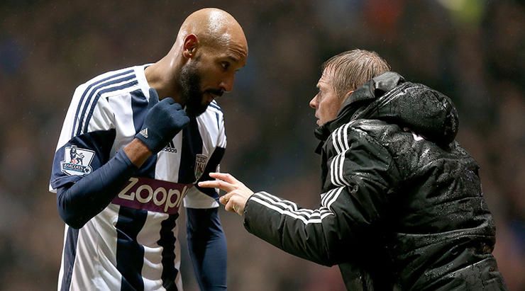West Bromwich Albion first team coach Keith Downing speaks to Nicolas Anelka during a break in play