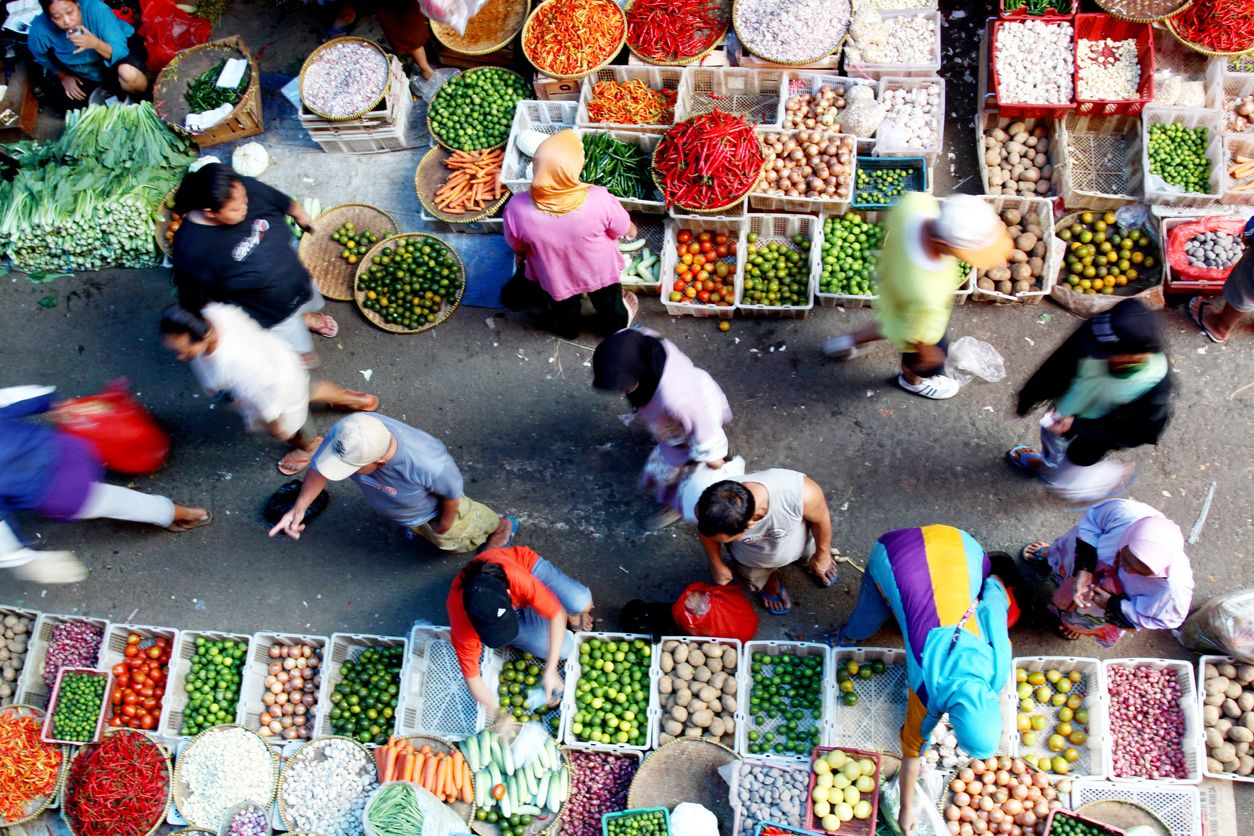 Jakarta, Indonesia-November 19, 2011: People are moving at traditional market that selling any kind of vegetables at kebayoran lama market in south jakarta. This is one of the biggest market in south jakarta.