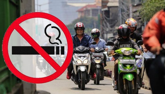 Mengendarai motor tidak boleh sambil merokok