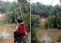 Kayak Flying Fox, Video Dua Cewek Bermotor Nyebrang Sungai Pake Tali Viral