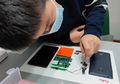 Bocah 9 Tahun Berhasil Bongkar HP Redmi 1 Untuk Dijadikan Karya Seni