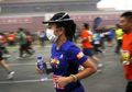 Pelari di Maraton Internasional Beijing Kenakan Masker