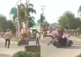 Tak Mau Berhenti, Pengendara Motor Ini Tabrak Pak Polisi Hingga Jatuh Terpelanting ke Aspal