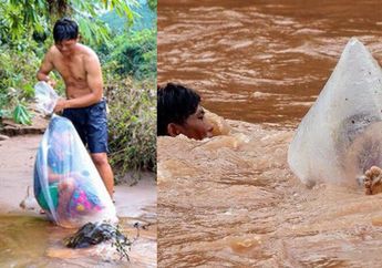Viral Foto Pria Seberangi Derasnya Arus Sungai Sambil Bawa Anak Sekolah yang Dibungkus Plastik