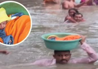 Demi Lakukan Penyelamatan Seorang Bayi Berusia 45 Hari, Pria Terjang Banjir Deras Tanpa Takut Buaya