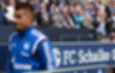 Schalke's Kevin-Prince Boateng takes his seat on the bench prior to the German Bundesliga soccer mat