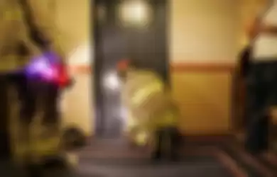 Rescue workers from the Ottawa Fire Department work to free 16 people trapped in an elevator between the second and third floors of the Capital Hill Hotel and Suites in Ottawa, Ontario on January 18, 2007.  The elevator had become stuck due to overcrowding.