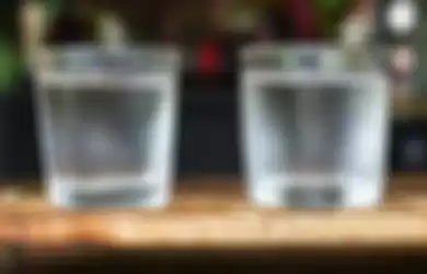 glasses of water on a wooden table