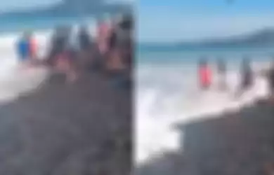 Video yang merekam prosesi ngayud abu jenazah yang dilaksanakan di pantai manggis, Karangasem, Bali ini memperlihatkan masyarakat mencoba menolong 2 orang yang hayut terhempas ombak. 