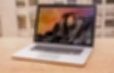 Ilustrasi laptop MacBook Pro dengan teknologi touch screen yang sedang dikembangkan Apple.
