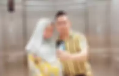 Azizul Haqim dan istrinya yang sedang mengandung. 