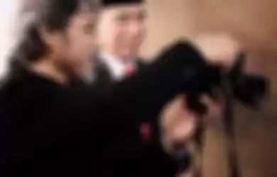 Fotografer kawakan Darwis Triadi bercerita soal pengalamannya memotret Jokowi dan KH Ma'ruf Amin.