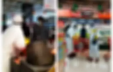 2 pengunjung supermarket menggunakan APD saat berbelanja