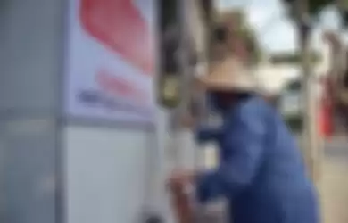 Mesin ATM yang mengeluarkan beras di Vietnam.