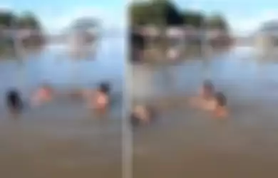Bocah-bocah yang viral karena dengan santai berenang bersama buaya di sungai.