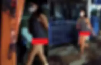 Video yang menunjukan seorang wanita bermasker berjalan santai tanpa mengenakan celana.