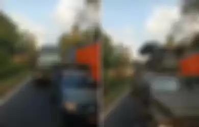 Tangkapan layar video viral sopir truk enggan minggir saat rombongan pengangkut alutsista lewat.