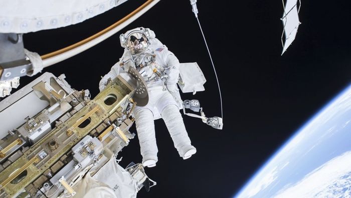 Expedition 46 Flight Engineer Tim Kopra performs a spacewalk outside the International Space Station