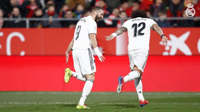 Dua pemain Real Madrid, Karim Benzema dan Marcelo, merayakan gol dalam laga leg kedua perempat final Copa del Rey melawan Girona di Stadion Municipal de Montilivi, 31 Januari 2019.
