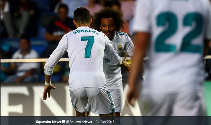 Penyerang Juventus, Cristiano Ronaldo, saat masih berseragam Real Madrid bersama  bek Marcelo Vieira.
