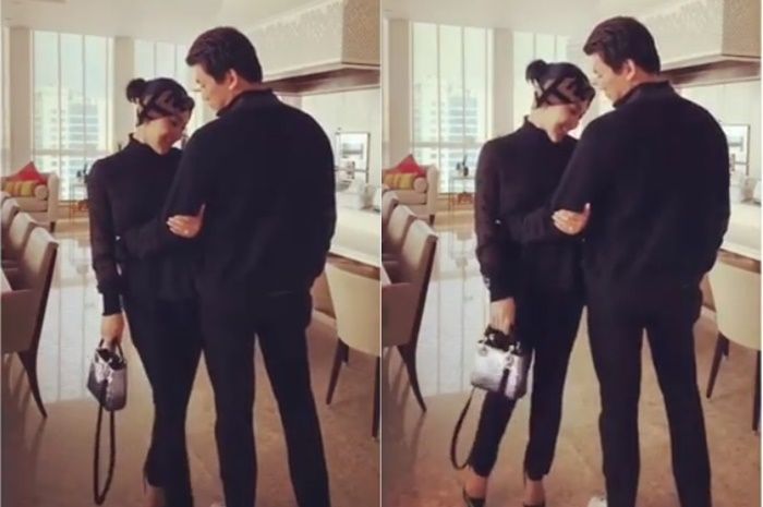Syahrini dan Reino Barack tampil kompak dalam busana serba hitam dan tenteng tas mewah