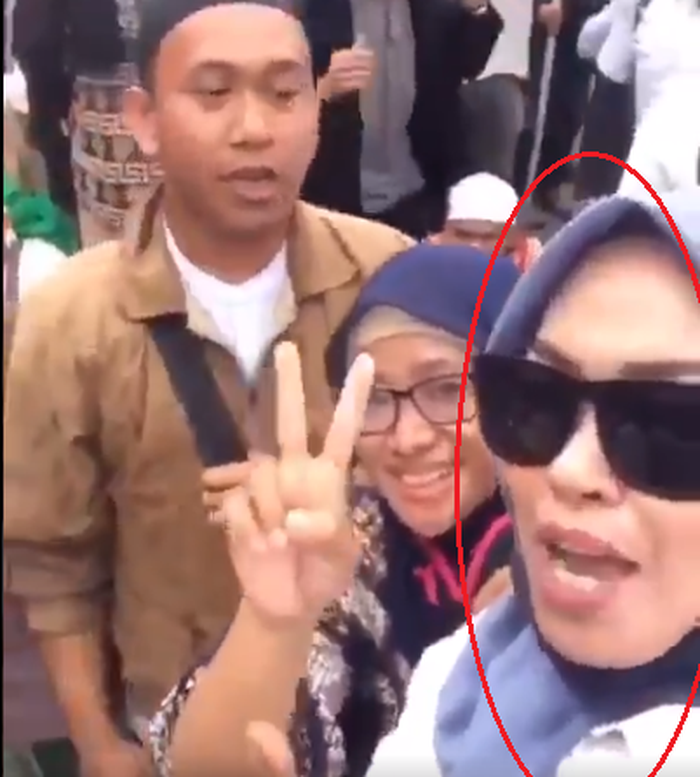 HS dan sosok wanita yang jadi buron polisi.