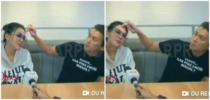 Reino Barack tanpa sadar rapikan rambut Syahrini di tengah sesi wawancara dengan media.