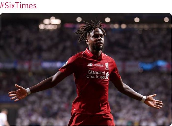 Penyerang Liverpool, Divock Origi, merayakan gol ke gawang Tottenham Hotspur dalam laga final Liga Champions di Stadion Wanda Metropolitano, Sabtu (1/6/2019).