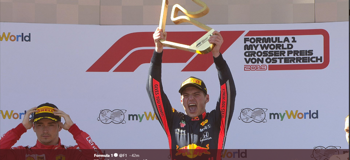 Pebalap Red Bull Honda, Max Verstappen, merayakan kemenangannya di GP Austria 2019, Minggu (30/6/2019).