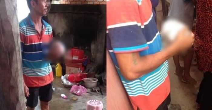 Sang ayah yang bersedih membawa potongan kepala bayinya.