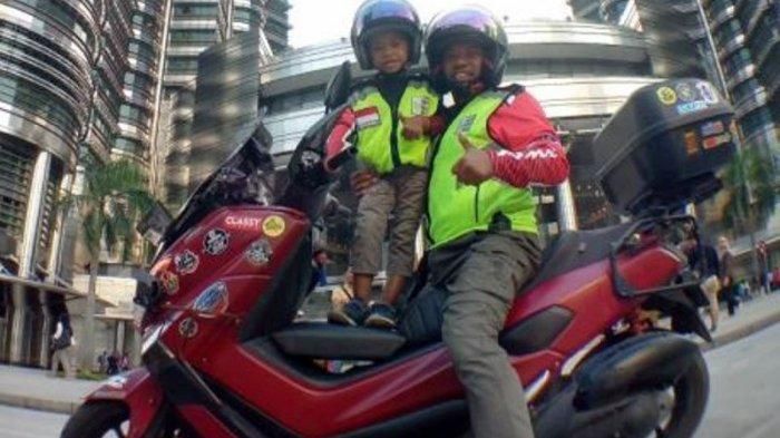 Lilik Gunawan (38) bersama putranya.