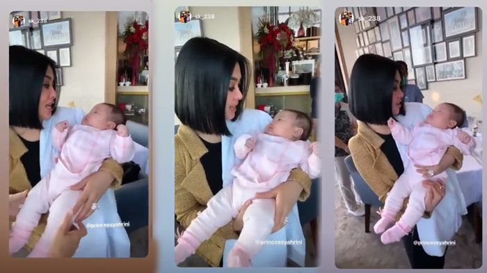 Momen Syahrini saat menggendong bayi temannya.