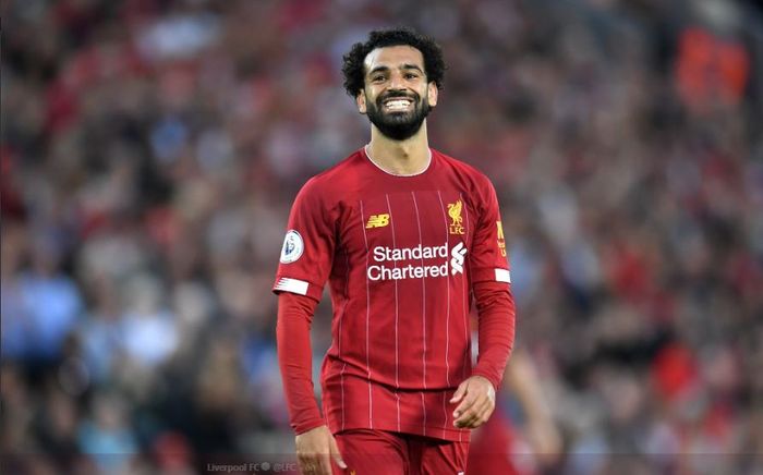 Penyerang Liverpool FC, Mohamed Salah, tersenyum dalam laga pekan pertama Liga Inggris kontra Norwich City di Stadion Anfiel, Sabtu (10/8/2019).