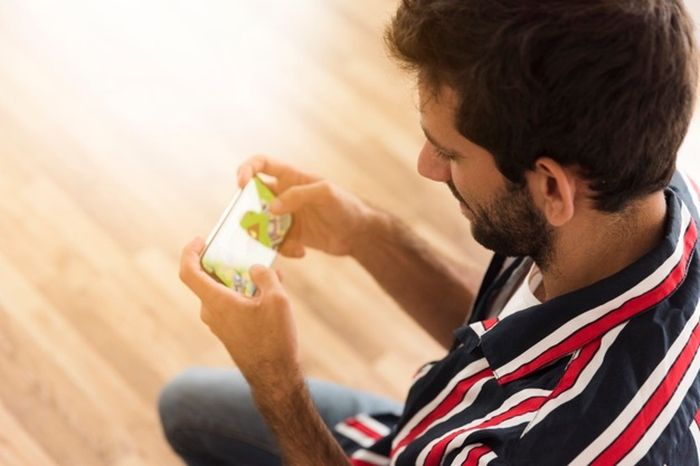 Illustration of man playing online game.