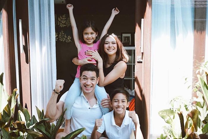 Nana Mirdad and Andrew White with their daughter and son.