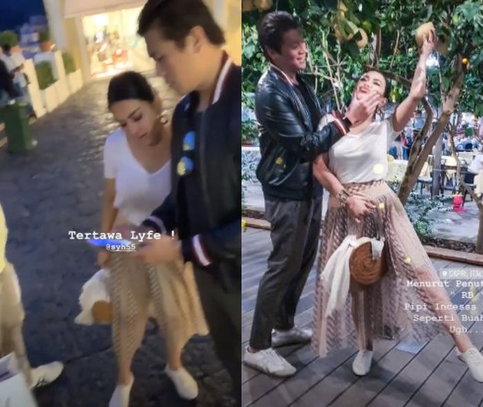 Syahrini mengenakan rok bernuansa warna krem beraksen transparan