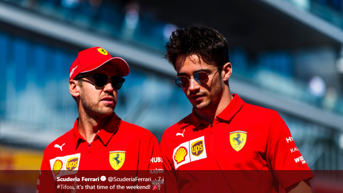 Dua pembalap Ferrari, Sebastian Vettel (kiri), berbicara kepada rekan setimnya, Charles Leclerc, jelang balapan F1 GP Rusia di Sirkuit Sochi, 29 September 2019.