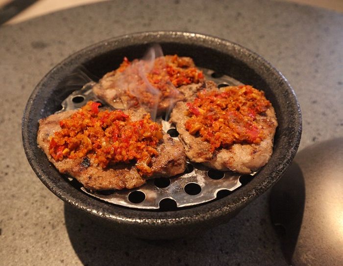 Dendeng batoko, a Padangnese food served at NUSA Indonesian Gastronomy. It releases a smoke when the lid is opened.