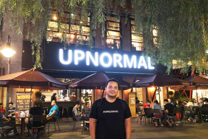 CEO of CRP group, Rex Marindo, in front of Upnormal Cafe branch in Cihampelas, Bandung.