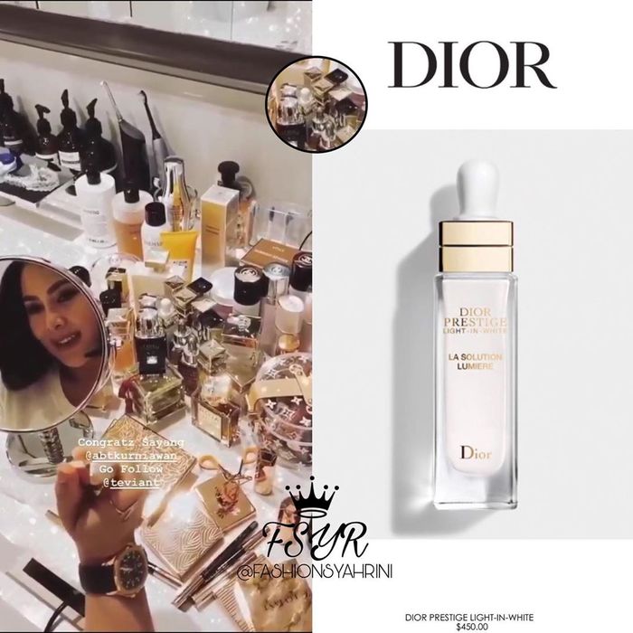 Syahrini tampak berfoto di depan cermin dengan lata belakang meja rias penuh dengan botol skin care dan parfum