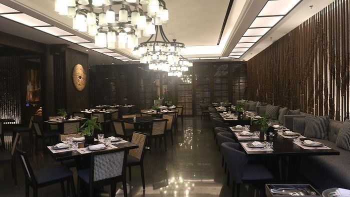 Seia Restaurant at Menara Astra highlights back-to-nature concept with bamboo-styled walls and plant pots as centrepieces
