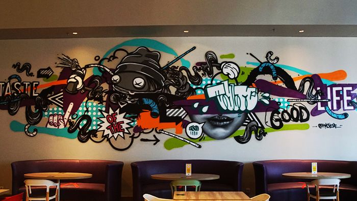 iBis Styles Mangga Dua Square is adorned with pop-art-themed murals and artworks.