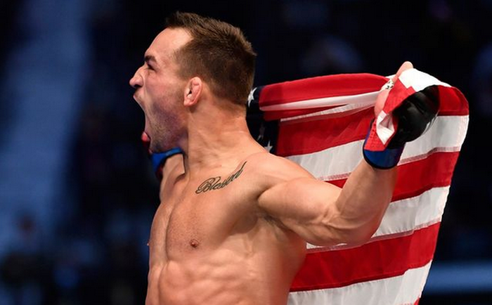 Michael Chandler saat merayakan hasil UFC 257 luar biasa yang ia petik Minggu (24/1/2021).